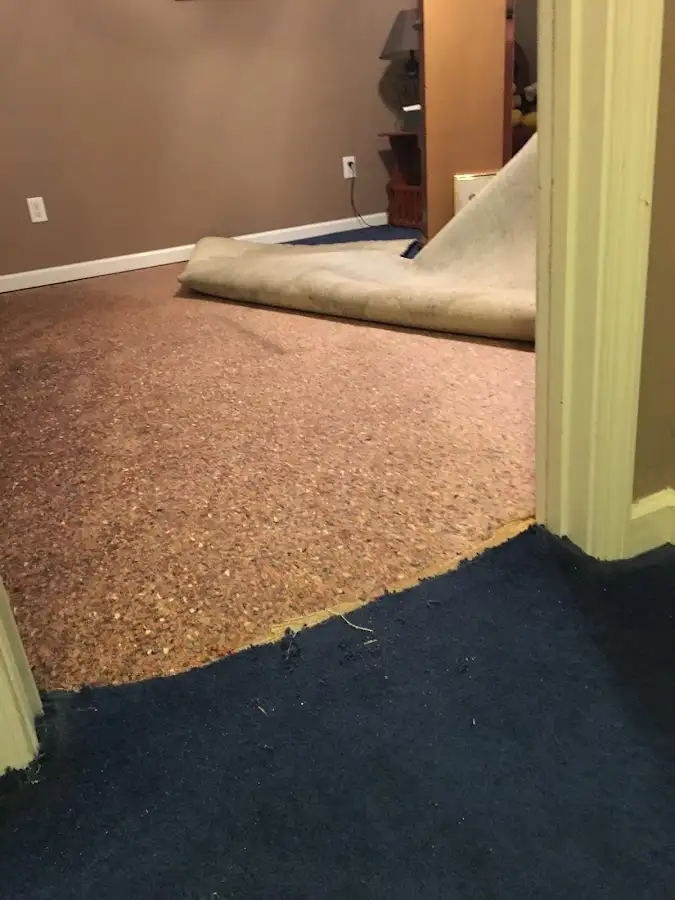 Carpet pad removal revealing water damage during Drying & Dehumidification in White Settlement